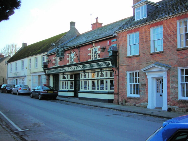 A traditional English stone village pub exterior, similar to the local at Chatton