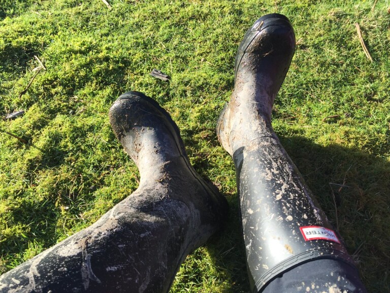 A pair of wellington boots resting outdoors, essential packing for a Northumberland countryside break