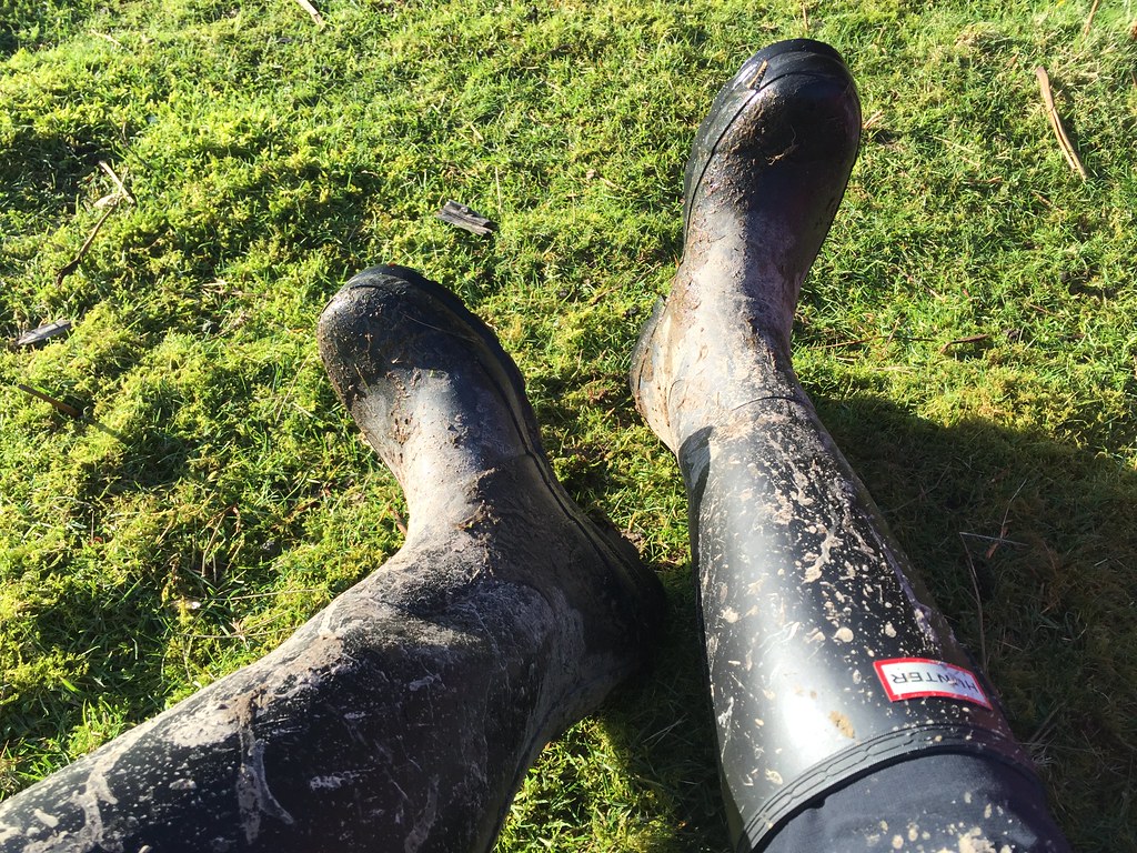 A pair of wellington boots resting outdoors, essential packing for a Northumberland countryside break