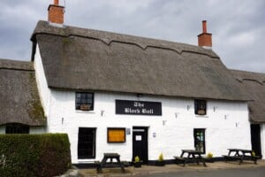 Thatched village pub in rural Northumberland, similar to the local near Chatton