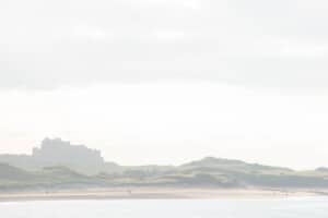 Bamburgh Castle overlooking the beach on the Northumberland coast