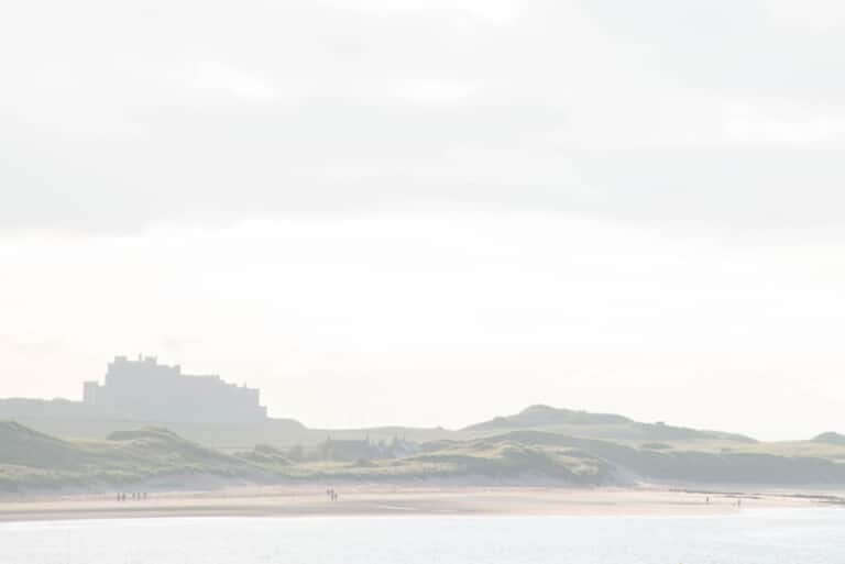 Bamburgh Castle overlooking the beach on the Northumberland coast
