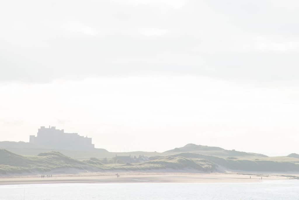 Bamburgh Castle overlooking the beach on the Northumberland coast